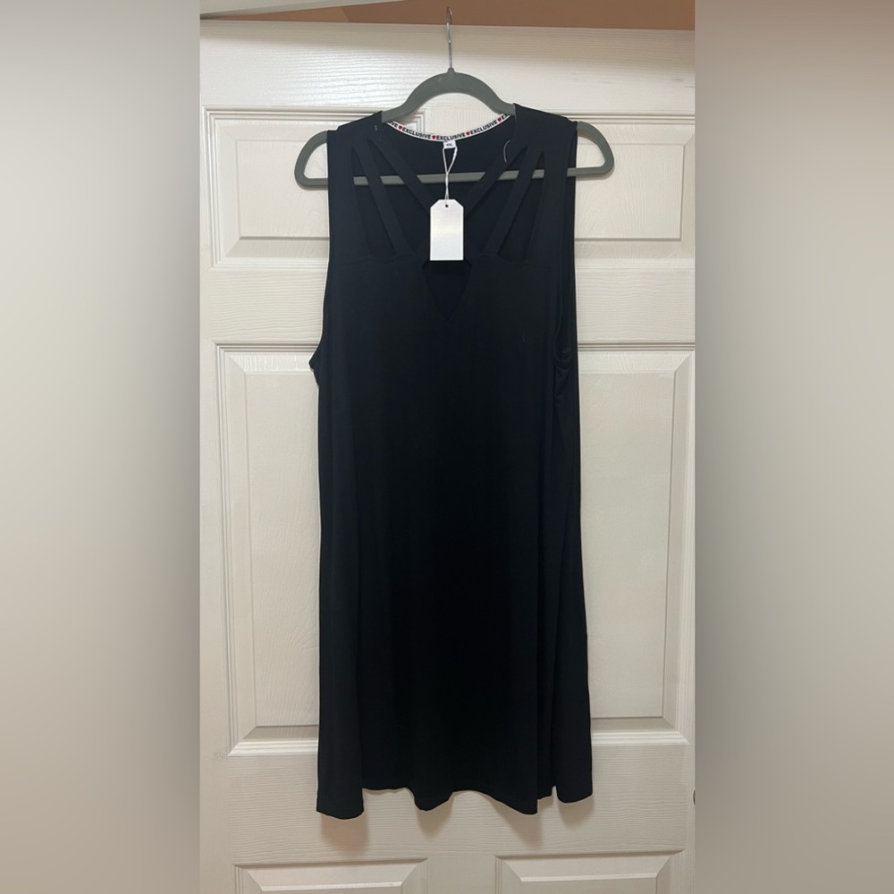 LOWER Price drop!! NWT Black cotton dress with cris-cross cut outs on the front.